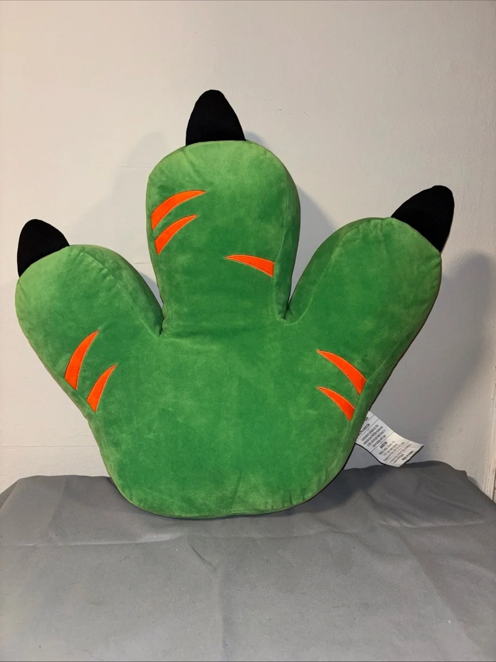 Hobby lobby green dinosaur foot throw pillow